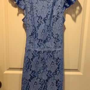 Blue, cocktail dress with pockets and open back.